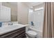 Bathroom featuring a vanity with sink, toilet, and tub with shower and neutral-toned curtain at 282 Foxpath Loop, Myrtle Beach, SC 29588