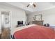 Bright bedroom featuring hardwood floors and an ensuite bathroom at 282 Foxpath Loop, Myrtle Beach, SC 29588