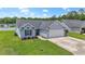 Well-maintained single-story home featuring a two-car garage, lush lawn, and appealing design at 282 Foxpath Loop, Myrtle Beach, SC 29588