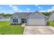 Charming single-story home with a manicured lawn, attached garage, and inviting curb appeal at 282 Foxpath Loop, Myrtle Beach, SC 29588