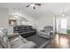 Inviting living room with leather seating, an open layout, wood floors, and views to the dining area at 282 Foxpath Loop, Myrtle Beach, SC 29588