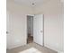 This bedroom offers plush carpet, a door, and neutral walls at 3027 Deerberry Place, Longs, SC 29568
