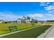 Bocce Ball court with outdoor seating and club house in the background at 3027 Deerberry Place, Longs, SC 29568