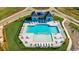 Aerial view of a community pool with ample seating and a clubhouse at 3027 Deerberry Place, Longs, SC 29568