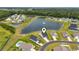 Aerial view of neighborhood featuring homes, ponds, and manicured green spaces at 305 Portofino Dr., Myrtle Beach, SC 29579