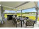 Relaxing backyard patio with outdoor dining and hot tub overlooking the serene lake at 305 Portofino Dr., Myrtle Beach, SC 29579