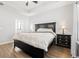 Spacious bedroom features a ceiling fan, wood floors, and a neutral color palette at 305 Portofino Dr., Myrtle Beach, SC 29579