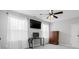 Bright bedroom featuring two windows, a ceiling fan, and ample natural light at 305 Portofino Dr., Myrtle Beach, SC 29579