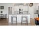 Open-concept kitchen with granite counters, stainless appliances, and island seating at 305 Portofino Dr., Myrtle Beach, SC 29579