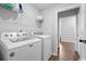 Laundry room featuring modern appliances, convenient storage shelves and a neutral color palette at 305 Portofino Dr., Myrtle Beach, SC 29579