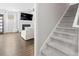 Cozy living room with a fireplace and an adjacent staircase at 305 Portofino Dr., Myrtle Beach, SC 29579