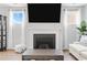 Comfortable living room features a fireplace, large TV, and plush furnishings at 305 Portofino Dr., Myrtle Beach, SC 29579