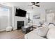 Cozy living room featuring a fireplace, large TV, and comfortable white sofas at 305 Portofino Dr., Myrtle Beach, SC 29579