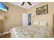A bedroom with a bed featuring a patterned cover and white headboard at 305 Shuffleboard Ct., Myrtle Beach, SC 29572