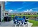 Back patio overlooks a manicured lawn and pond, great for outdoor entertaining at 316 Lifestyle Court, Surfside Beach, SC 29575