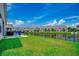 Spacious backyard features a patio area with lake views and lush green grass at 316 Lifestyle Court, Surfside Beach, SC 29575