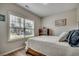 Cozy bedroom with natural light, wood floors, and neutral wall color at 316 Lifestyle Court, Surfside Beach, SC 29575