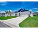 Charming home exterior featuring a two-car garage, well-kept lawn, and manicured landscaping at 316 Lifestyle Court, Surfside Beach, SC 29575