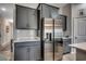 Stylish kitchen features modern appliances and gray cabinets at 316 Lifestyle Court, Surfside Beach, SC 29575