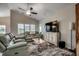 Comfortable living room with couches, fan, and mounted TV at 316 Lifestyle Court, Surfside Beach, SC 29575