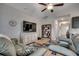Comfortable living room with a large television, sectional sofa, and neutral decor at 316 Lifestyle Court, Surfside Beach, SC 29575