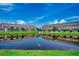 Beautiful pond view with surrounding buildings creates a serene and inviting atmosphere at 316 Lifestyle Court, Surfside Beach, SC 29575