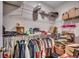 Spacious walk-in closet with multiple shelves and a combination of organized and disorganized storage at 316 Lifestyle Court, Surfside Beach, SC 29575