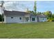 Expansive backyard with a well-manicured lawn and a charming single-story home at 3204 Fowler School Rd., Loris, SC 29569