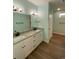 Bathroom boasts double sinks, granite countertops, white cabinets, and ample counter space at 3204 Fowler School Rd., Loris, SC 29569