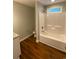 Bright bathroom includes a bathtub, toilet, and tiled floor at 3204 Fowler School Rd., Loris, SC 29569