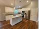 Modern kitchen features white cabinets, granite countertops, stainless steel appliances, and an island at 3204 Fowler School Rd., Loris, SC 29569