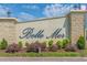 Elegant community sign for Belle Mer set against a backdrop of lush landscaping and a clear sky at 379 Mikita Dr., Surfside Beach, SC 29575
