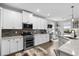 Contemporary kitchen showcasing modern appliances, white cabinets, and sleek countertops at 379 Mikita Dr., Surfside Beach, SC 29575
