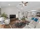 Spacious living room featuring a vaulted ceiling, hardwood floors, and modern furniture arrangement at 379 Mikita Dr., Surfside Beach, SC 29575
