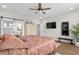 Main bedroom with hardwood floors, television, closet access and a ceiling fan at 379 Mikita Dr., Surfside Beach, SC 29575