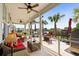 Relaxing screened patio with lake views, comfortable wicker seating, and ceiling fans at 379 Mikita Dr., Surfside Beach, SC 29575