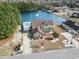 Aerial view of the property showcasing the house, lake, pool, and surrounding neighborhood at 400 Dog Pen Ct., Myrtle Beach, SC 29588