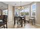 Cozy dining area features large windows with backyard views, and a chandelier for intimate dining at 400 Dog Pen Ct., Myrtle Beach, SC 29588