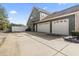 Spacious three-car garage with an extensive driveway and well-maintained side yard at 400 Dog Pen Ct., Myrtle Beach, SC 29588