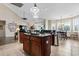 Spacious kitchen boasts granite countertops, center island, pendant lighting and adjacent dining area at 400 Dog Pen Ct., Myrtle Beach, SC 29588