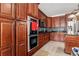 Charming kitchen featuring sleek appliances, beautiful cabinetry, tile backsplash and easy-to-clean tile flooring at 400 Dog Pen Ct., Myrtle Beach, SC 29588