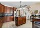 Cherry wood kitchen with stainless steel appliances, granite counters, tile backsplash and a large center island at 400 Dog Pen Ct., Myrtle Beach, SC 29588