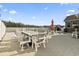 Spacious patio featuring an outdoor dining set, perfect for entertaining or relaxing by the pool at 400 Dog Pen Ct., Myrtle Beach, SC 29588