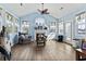 Relaxing sun room features beautiful windows, vaulted ceilings, a fireplace and access to backyard at 400 Dog Pen Ct., Myrtle Beach, SC 29588