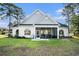 Well-maintained backyard with a screened-in porch, perfect for enjoying the outdoors at 400 Summerwood Ct., Myrtle Beach, SC 29579