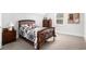 Bedroom featuring a wooden bed frame, and dresser with bright window light, perfect for relaxation at 400 Summerwood Ct., Myrtle Beach, SC 29579
