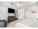 Comfortable bedroom with neutral decor, a tray ceiling, and ample natural light at 400 Summerwood Ct., Myrtle Beach, SC 29579
