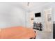 Bright bedroom featuring modern furnishings, a wall-mounted TV, and an open doorway to a bright area at 400 Summerwood Ct., Myrtle Beach, SC 29579