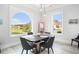 Cozy dining area boasts a large window with scenic lake views, creating an inviting space for meals at 400 Summerwood Ct., Myrtle Beach, SC 29579