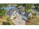 Stunning lakefront home features an elegant stone facade, a three-car garage, and a beautifully landscaped yard at 400 Summerwood Ct., Myrtle Beach, SC 29579